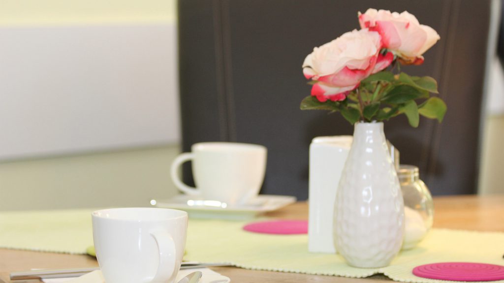 Flower vase on breakfast table
